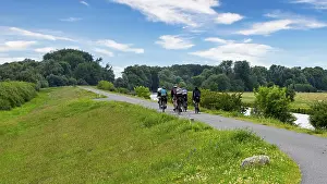 Fitness In Nature Prints: Cyclist on a cycle path by the river