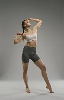Elegant Dance Pose Prints: A dancer elegantly poses in a minimalist studio