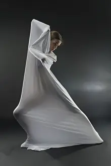 Female Dancer Pose Prints: A dancer gracefully interacts with white fabric