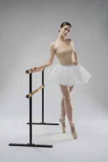Ballet Dancer Pose Prints: A dancer in a light tutu poses elegantly at the barre