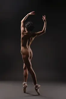 Ballet Dancer Prints: A dancer performs elegant ballet movements in a soft light