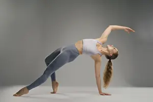 Minimalist Studio Setting Prints: A dancer performs an impressive flexible pose in a minimalist studio setting