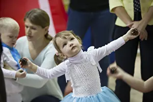 Prints of December 25, 2018 Belarus. city of Gomil. Celebration in the city. Little girl dancing at the matinee Belarus Prints: December 25, 2018 Print: Gomel City Celebration