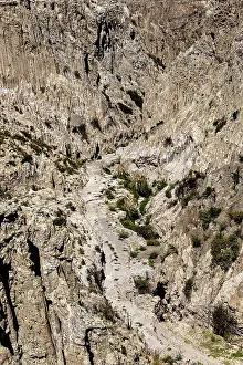 Valle De La Luna Moon Valley Prints: Deep rocky gorge with sparse vegetation