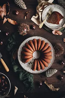 Chestnut Cake Prints: A delicious chestnut cake sits elegantly on a rustic table
