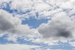 Natural Light Photography Prints: Dense clouds float in the blue sky and create a calming landscape