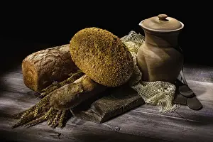 Studio Background Images Prints: Different kinds of bread and ceramic vase on a studio background