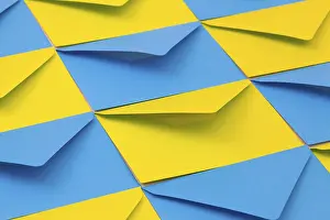 Office Stationery Prints: Different yellow and blue envelopes on the table