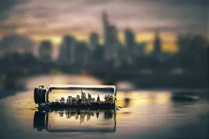Evening Sun Germany Prints: Digital Composing, skyline at sunset in a message in a bottle