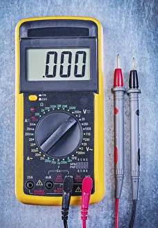 Single Object Studio Photography Prints: Digital electrical tester on metallic surface top view