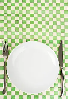 Weight Loss Concept Prints: Empty dish, knife and fork
