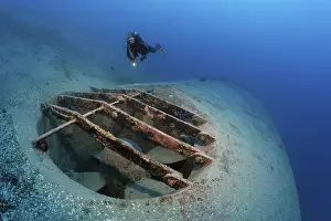 Water Sports Adventure Prints: Diver looking at bow thrusters on shipwreck
