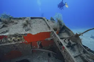 Atlantic Ocean Underwater Photo Prints: Divers inspecting a rusty part of a sunken ship