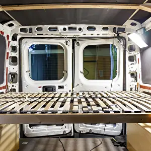 Images Dated 17th August 2024: DIY Camper Van Conversion Print: Handcrafted Bed Frame