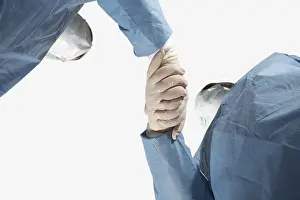 Medical Care Professionals Prints: Two doctors linking hands