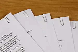 Office Stationery Prints: Documents held together by paper clips