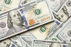 One Hundred Dollar Bill Detail Prints: One hundred dollar bills laying on flat surface