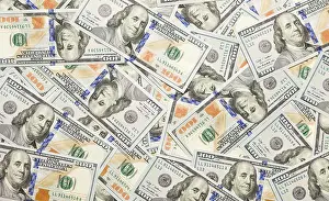 One Hundred Dollar Note Prints: One hundred dollar bills laying on flat surface