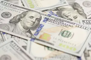 One Hundred Dollar Bill Detail Prints: One hundred dollar bills laying on flat surface