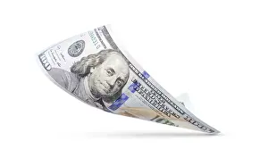 US Dollar Note Prints: One hundred dollar bill floating down to surface with drop shadow isolated on a white background