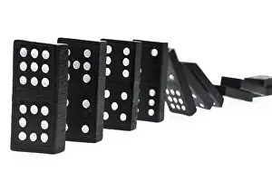 Studio Shot Of Dominoes Prints: Dominoes falling over