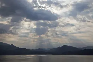 Dramatic Cloud Formation Prints: Dramatic cloud formation, sunbeams behind dark clouds