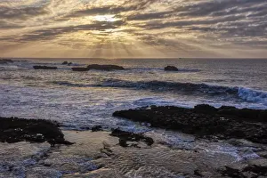 Cloudy Evening Skies Prints: Dramatic cloud formations and sunbeams over the sea at sunset