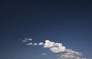 Atmospheric Landscapes Prints: Dramatic clouds on a deep blue sky