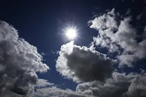 Cloudy Weather Forecast Prints: Dramatic cloudscape with (cumulus) clouds and sunrays