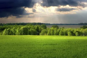 Overcast Sky Photography Prints: Dramatic cloudscape over village landscape