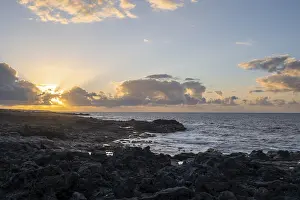 Spanish Coastal Scenery Prints: Dramatic cloudy sky with sunbeams at sunset