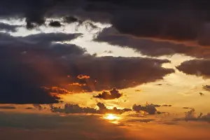 Sweden Landscape Photography Prints: Dramatic cloudy sky at sunset, sunbeams