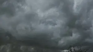 Dark Storm Clouds Prints: Dramatic dark storm clouds and heavy rainfall