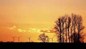 Dramatic Evening Sky Prints: Dramatic evening sky with sunset over the Elbe dike