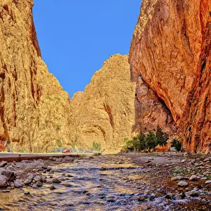 Deserted Waterfront Landscape Prints: Dramatic gorge with river lined with towering red rocks