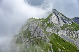 Cloudy Mountain Peak Prints: Dramatic mountain landscape with clouds