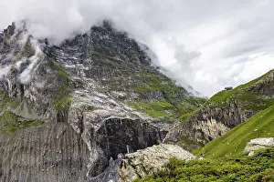 Deserted Mountainous Region Prints: Dramatic mountain landscape covered in clouds