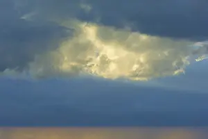 Western Europe Landscape Prints: Dramatic sky with bright clouds in the sunlight shining through a gap