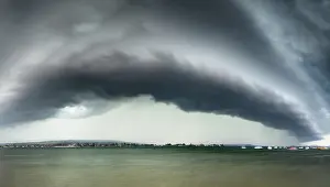 Framed Print : Print of a dramatic sky with dark clouds over a calm lake Framed Print : Print of a dramatic sky with dark clouds over a calm lake