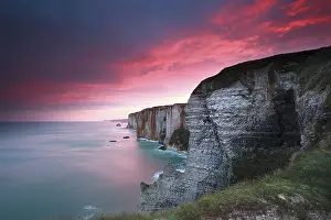 Etretat Rock Formations Prints: Dramatic sunrise over cliffs in Atlantic ocean