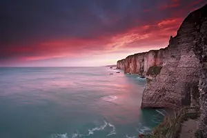 Morning Light Atmosphere Prints: Dramatic sunrise over ocean and cliffs