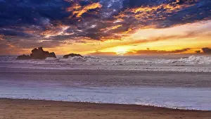Sunset On The Rocky Shore Prints: Dramatic sunset on the beach, rocks in the surf