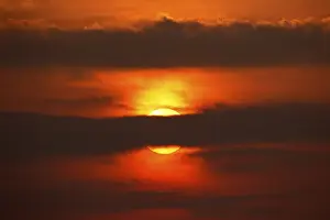 Northern Germany Sunset Prints: Dramatic sunset behind clouds, Schleswig-Holstein