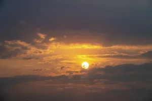 African Wildlife Refuge Prints: Dramatic sunset with clouds and sun
