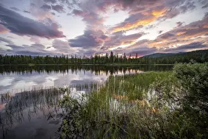 Scandinavian Evening Atmosphere Prints: Dramatic sunset by the river Namsen with reflection
