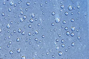 Dew Drop Prints: Drops of water on a blue surface