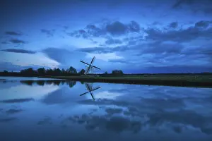 Central Europe Cloudscape Prints: Dutch windmill and clouds in dusk reflected in river