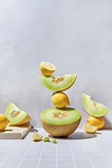 Healthy Eating Decoration Prints: A dynamic arrangement of melons and lemons on a tiled surface