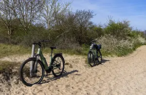 Rugen Island Coastline Prints: E-bikes on the beach at Alt-Reddevitz