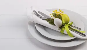 Easter Dinner Table Setting Prints: Easter dinner table setting on white wooden table